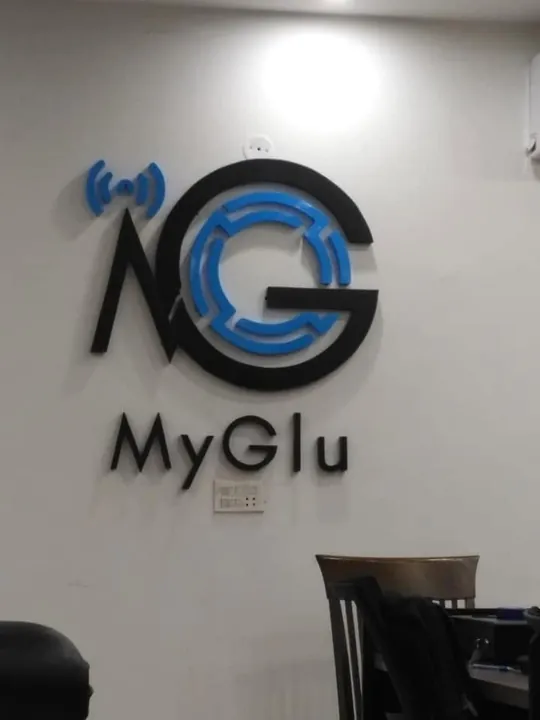 MyGlu logo in raised letters on an office wall